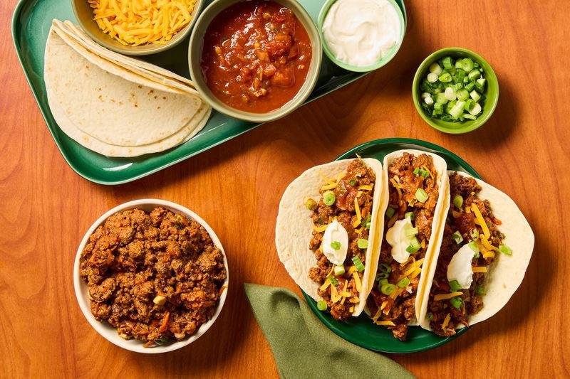 A colorful collage featuring five quick meals including creamy chicken pasta, beef tacos, shrimp stir-fry, grilled cheese with tomato soup, and BBQ chicken flatbread pizza ready in 30 minutes.